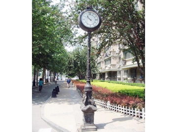 Outdoor pedestal clock with Roman Numerals